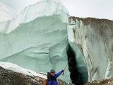 22 Jerome Ryan Points At True Glacier Below The Rubble On The Upper Baltoro Glacier We trekked back from Shagring camp to Concordia in cloudy weather, passing a side section of the Upper Baltoro Glacier that clearly shows that this isnt just rubble trekking trail, but a real glacier with ice.